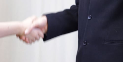 Money Exchange for Successful Business Deal and Handshake