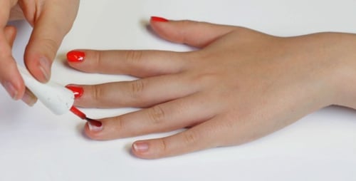 Applying Red Nail Polish for a Manicure