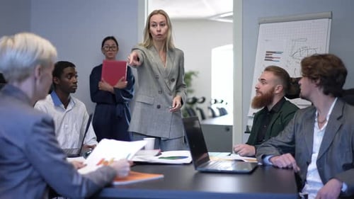 Tired Sad Angry Caucasian CEO Firing Group of Inefficient Multiethnic Managers in Office Indoors
