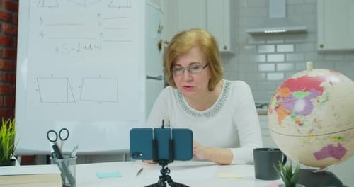 Woman Giving Geometry Lesson Online from Kitchen