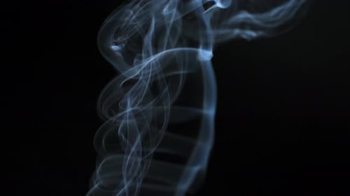 Abstract Smoke Flowing on Black Background