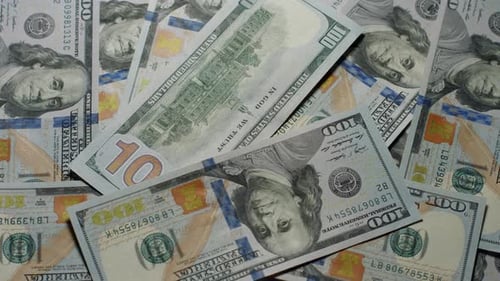 Scattering one hundred U.S. dollar bills