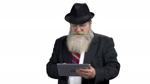 Senior Man Using a Tablet Device