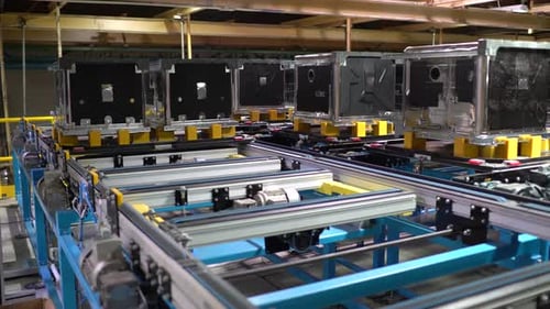 Metal Boxes Moving on Conveyor Belt in Factory