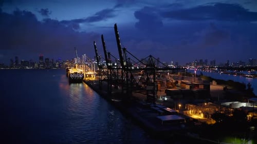 Night Shot of Port Miami Against the Backdrop of a Stormy Sky and City Panorama.