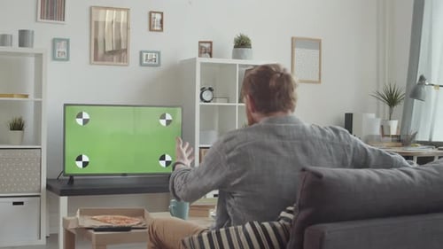 Disappointed Male Sport Fan Watching Math at Home