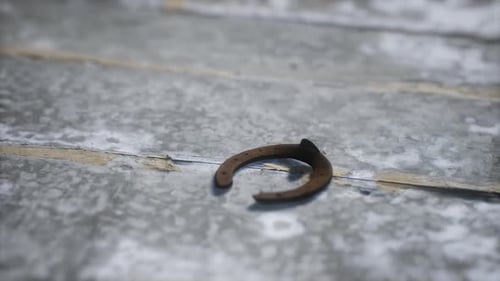 Rustic Horseshoe Rotating on Weathered Wooden Background