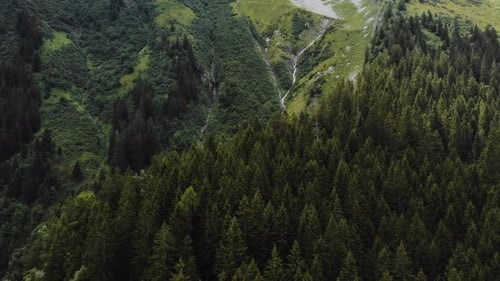 Epic Aerial Background Shot of Beautiful Green Mountain Landscape View and Rock Water Spring Stream