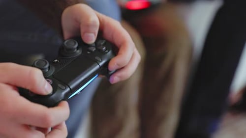 Person Playing Video Game with Controller