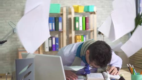 Young Man in the Office Loudly Heavily and Things Fall Off the Shelves