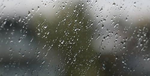 Raindrops on Window in a Rainy Day