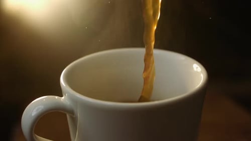 Pouring Coffee Into White Mug In The Daylight