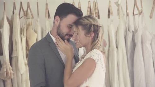 Romantic Couple Embracing in Bridal Shop