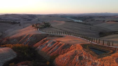 Crete Senesi Tuscan Rolling Hills, Farmhouse, and Cypress Road Aerial View in Tuscany