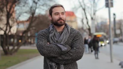 A Happy Bearded Man is Walking Around the City