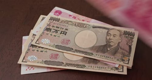 Pile of Currency on a Table