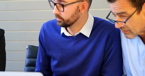 Business Meeting With Technology in Modern Office