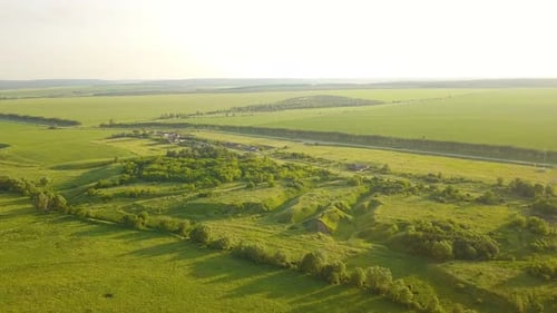 Village And Green Meadow