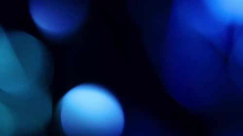 Abstract Blue Bokeh Moving Light Background
