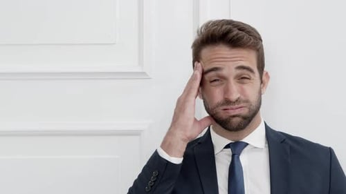 Businessman Massaging Temples