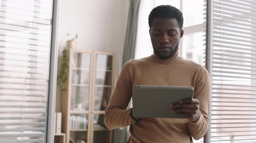 Portrait of African Businessman Using Tablet in Office