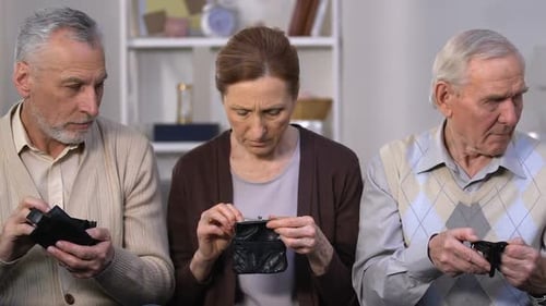 Senior Citizens Showing Empty Wallets Indoors