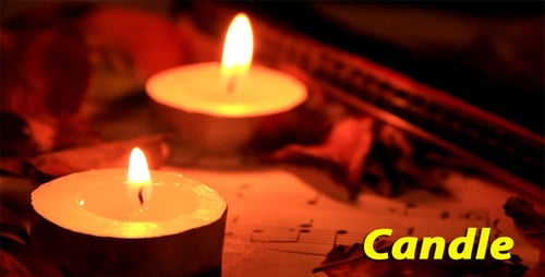 Glowing Candles and Musical Score in Dim Light