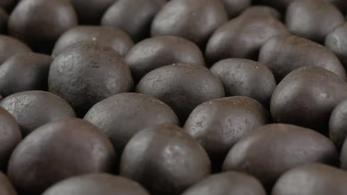 Pile of Dark Brown Chocolate Candies Close Up