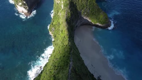 Aerial View Of Mountain Path On Top Of Cliffs Beside Kelingking Beach. Dolly Back, Tilt Up Reveal
