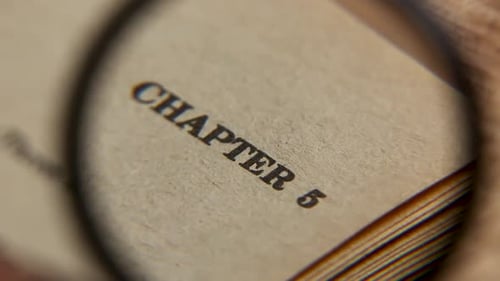 Magnifying Glass Focuses on Book Chapter