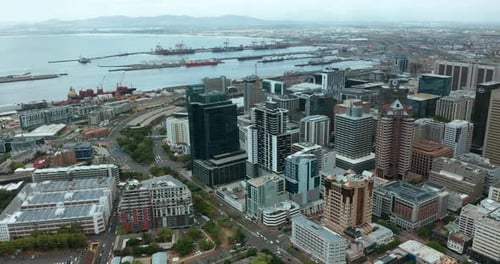 Wide Aerial Shot Tracking Forward Into the City of Cape Town During a Spectacular Sunset with Table