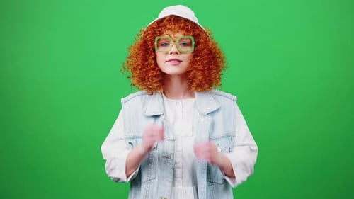 Young Awaiting Redhead Woman Looking at Camera with Expectation Seeing Great News and Dancing Chroma