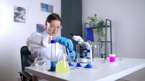 Young Scientist Conducting Research in Bright Lab
