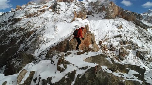 Climbing Up On Snowy Rocky Mountain