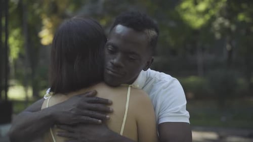 Couple Sharing Affectionate Embrace in Green Park