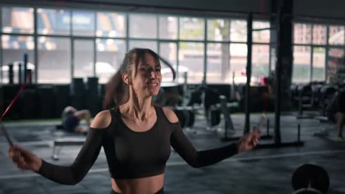 Woman Jumps Rope in Modern Gym