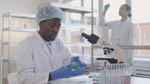 Scientist Analyzing Bacteria in Modern Laboratory