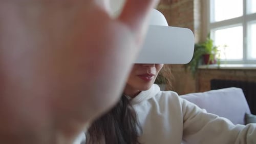 Woman Enjoys Virtual Reality Experience with VR Headset