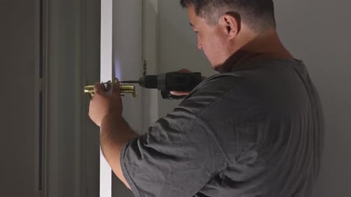 Carpenter Installation at Interior Wood Door Lock