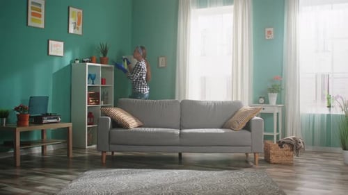 Woman Cleaning and Dancing in Living Room
