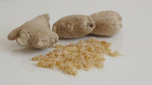 Slow tilt on sweet and candied ginger root 4K 2160p 30fps UltraHD footage - Cubes of crystallized