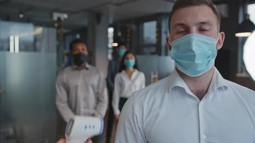 Temperature Checks in Modern Office During Pandemic