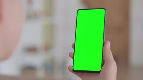 Close Up of Female Hand Using Smartphone with Green Chroma Key Screen