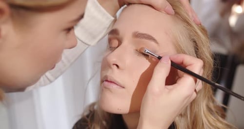 Makeup Artist Applies Eye Shadow With A Brush