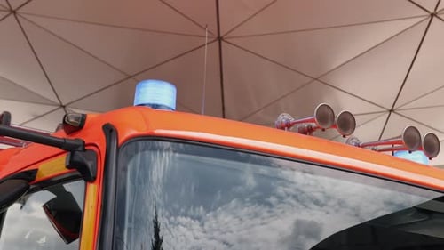 Bright Orange Firetruck Equipment in Urban Setting