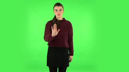 Woman Strictly Gesturing with Hands Shape Meaning Denial Saying NO. Green Screen