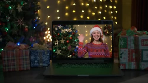 Christmas Video Call with a Young Woman Waving