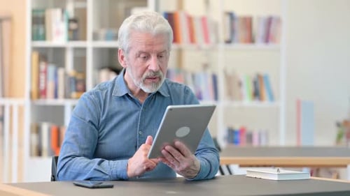 Senior Man having Video Call on Tablet