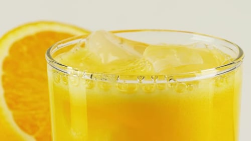 Refreshing Glass of Orange Juice with Ice