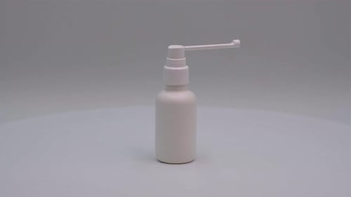 Rotating White Medical Spray Bottle Against Gray Background